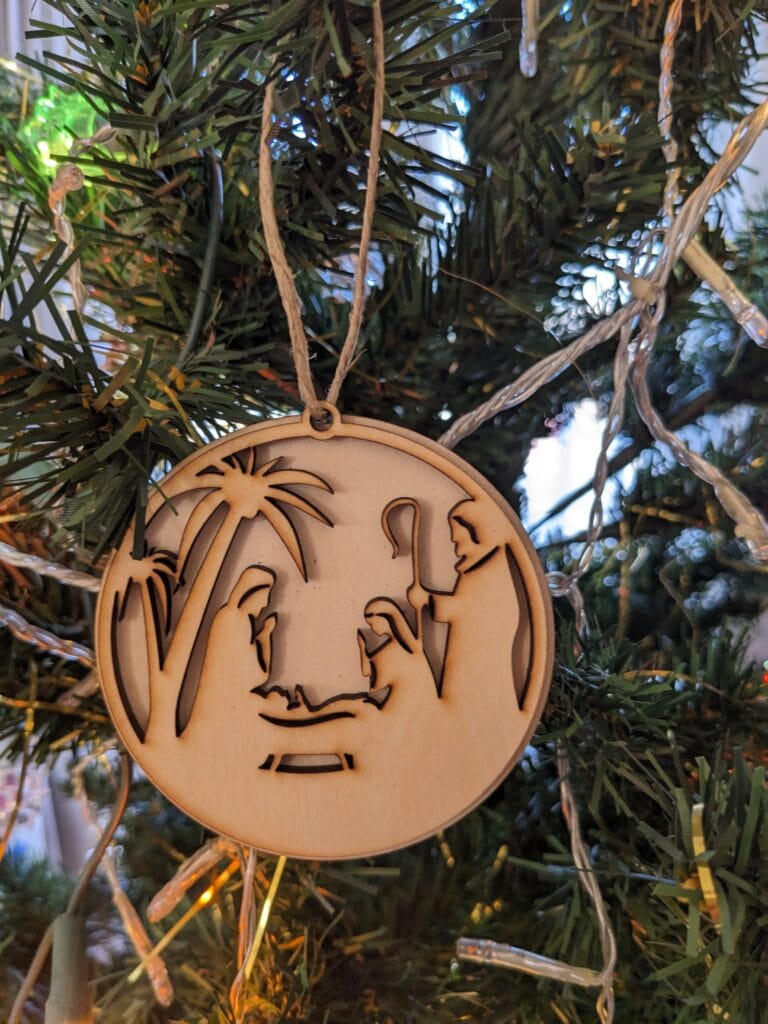 ornement de sapin de noël double parent enfant palmiers et un homme avec bâton