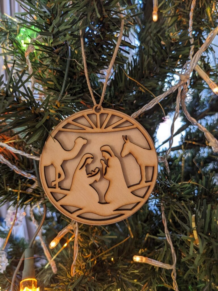 ornement de sapin de noël double couple avec enfant et âne chameau